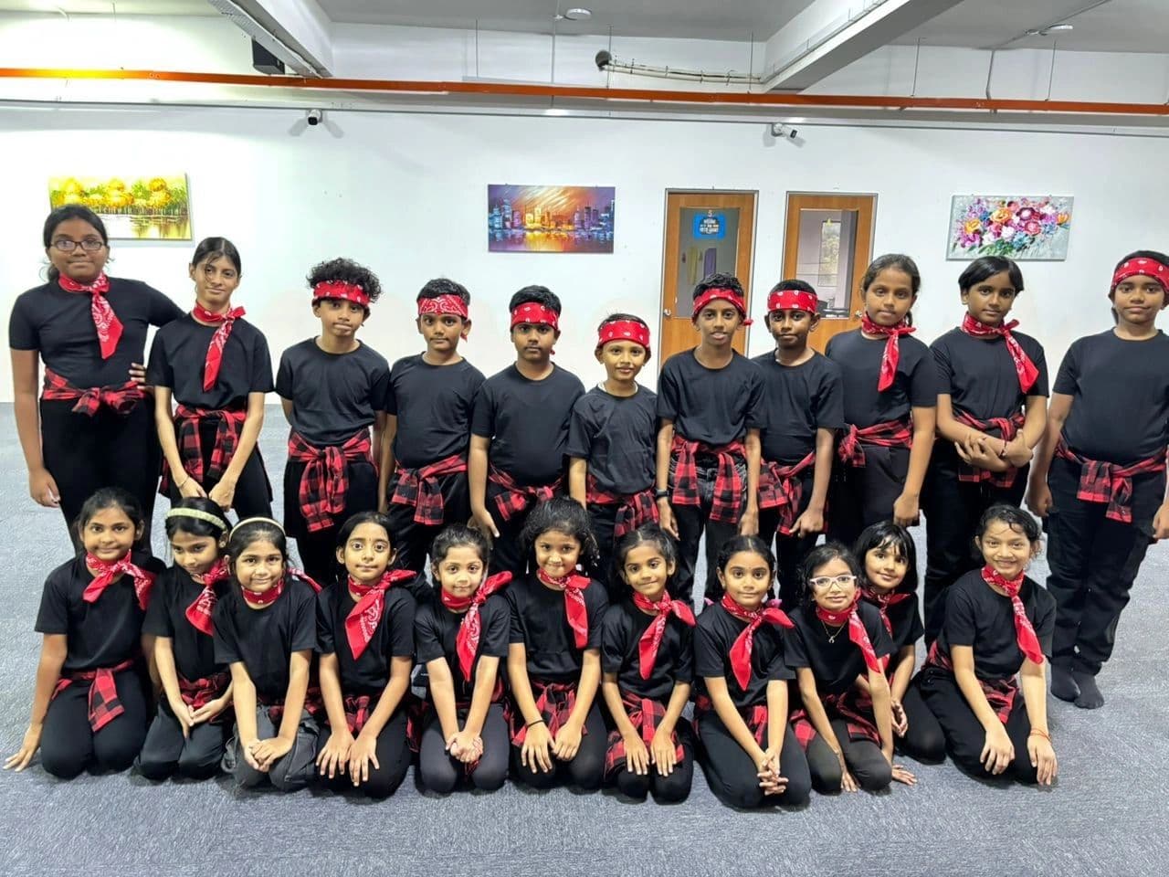 A group of students in black with red headbands